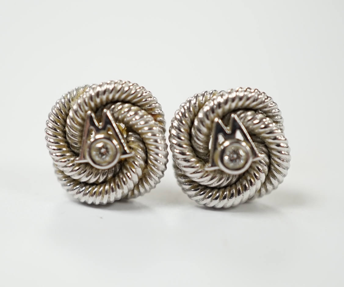 A pair of 750 and diamond chip set 'knot' ear studs with Boodles & Dunthorne butterflies, gross weight 5.2 grams. Condition - fair